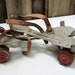 RESERVED for OldTechBiz -- Vintage Metal Roller Skates with Red Wheel Accents, for Display or Photography Prop