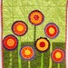poppy quilt- wall art quilt- 7 stems in red, orange, yellow and purple- "Purple Poppyluscious"