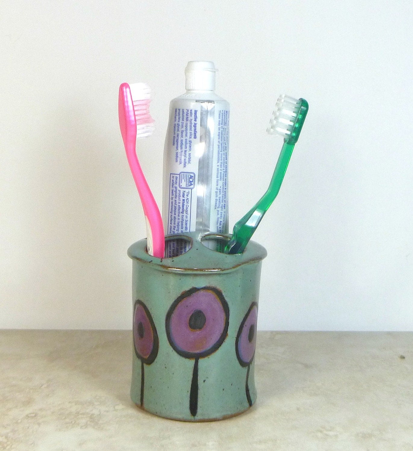 Ceramic toothbrush and toothpaste holder
