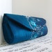 Teal blue silk clutch purse with floral lace overlay. Clutch bag. Fashion.