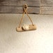 Miniature bird on a twig, native wall art