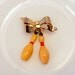 Vintage Bakelite Brooch 2 Bowling Pins on a Bow