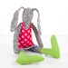 Black and white rabbit made from knitted pure silk , wearing red dress dotted pink and Striped green socks , handmade fabric doll
