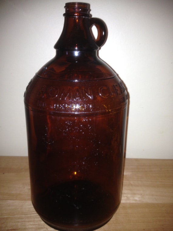 Items similar to Vintage brown glass Roman Cleanser bottle. on Etsy