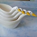 The gift collection.Vintage 70s plastic geese 4 measuring cups.Made by Avon. In original box. Mint condition.