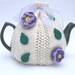 Cream teacosy with prple/lilac flowers