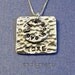 I love you more - pendant necklace of hammered and polished aluminum on a sterling silver chain.