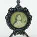 an old small french photo frame with Ste. Bernadette