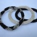 Set of three sparkly crocheted beaded bracelets in black, white and silver,Nepal roll on bracelets, fall 2012 collection