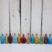 Vintage 12 Miniature Bitters medicine bottles beautiful suncatchers and perfect for oil blends, cell salts, homeopathy pellets 3 inches