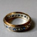 Antique Art Deco Wedding Band with Blue Topaz and Rock Crystal Stones set in Eternity Style, Circa 1920s