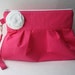 Pink clutch with white or pink flower