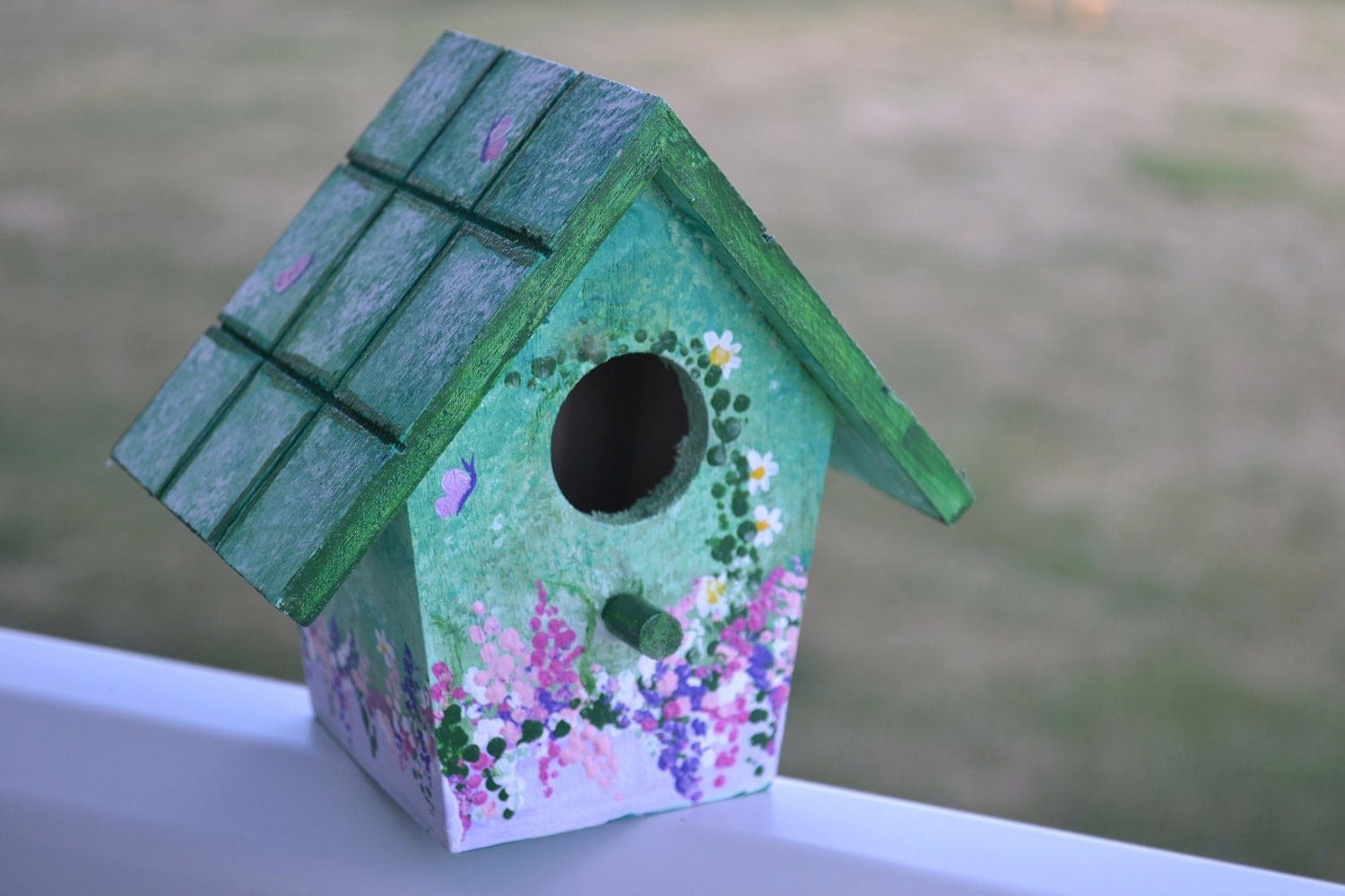 Floral hand painted birdhouse