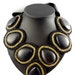 Striking Black Hematite Bib Necklace Adorned with Gold Beads