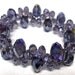 Crystal bracelet with 7mm purple crystals and 5mm light purple crystals on a stretchy cord