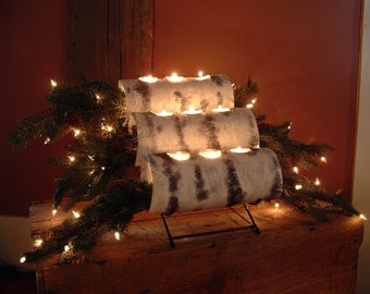Add a warm glow to your fireplace any season of the year with this attractive piece. Great for use with pillar candles