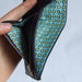 Black leather wallet with blue and yellow spot lining, cards and zip coins