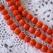 1 Strand Carved Orange Pumpkin Beads . approx 40 beads . carved stone 10mm . how0021