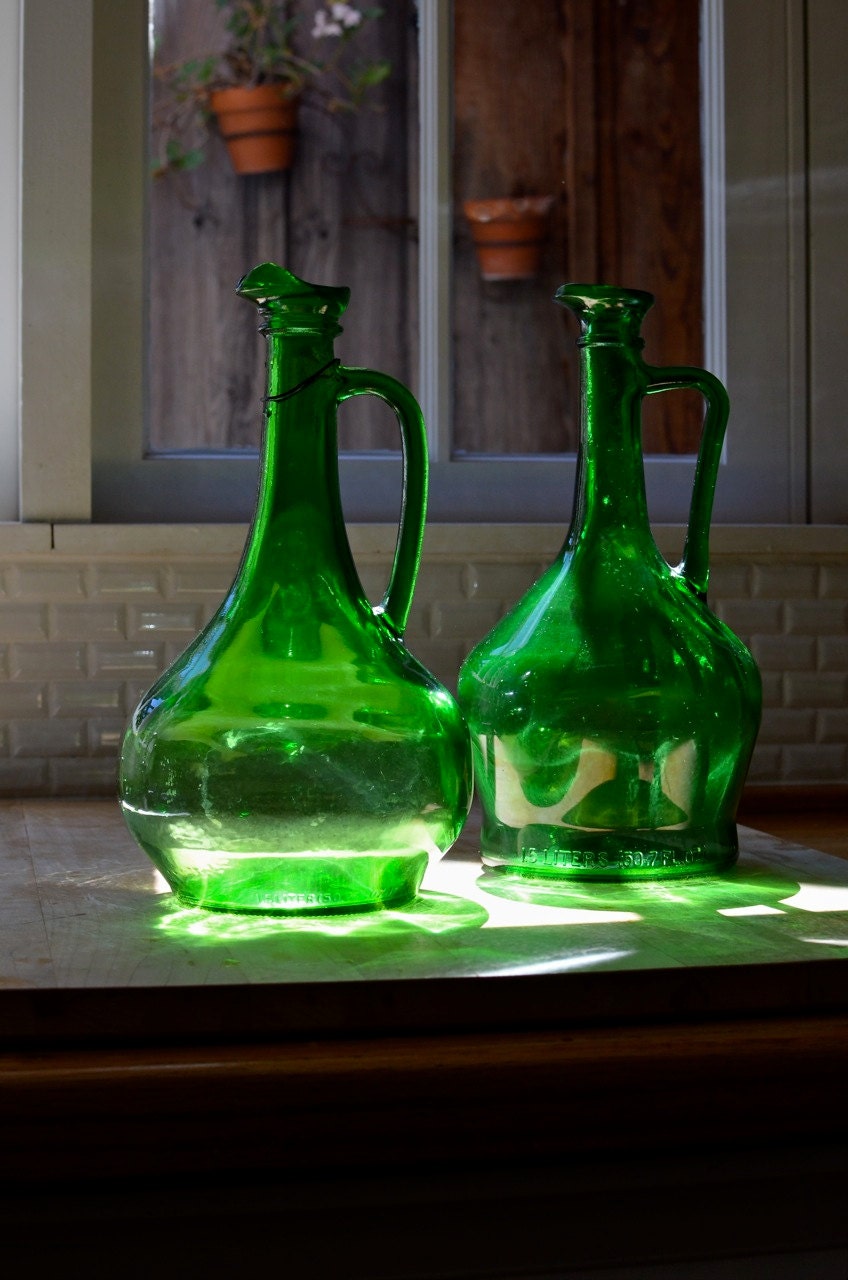 vintage green glass wine jugs pair 1970's