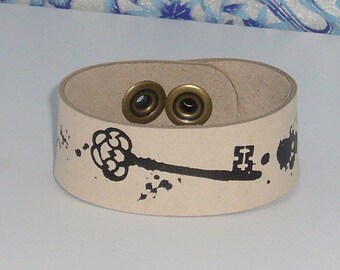 The "Ashes of Honor" leather wrist strap