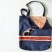 Navy canvas tote bag with red striped ribbon