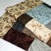 SERENE ELEGANCE Lap Quilt in taupe