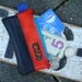 Eco friendly mini change purse wallet made from bicycle inner tube and scrap orange vinyl