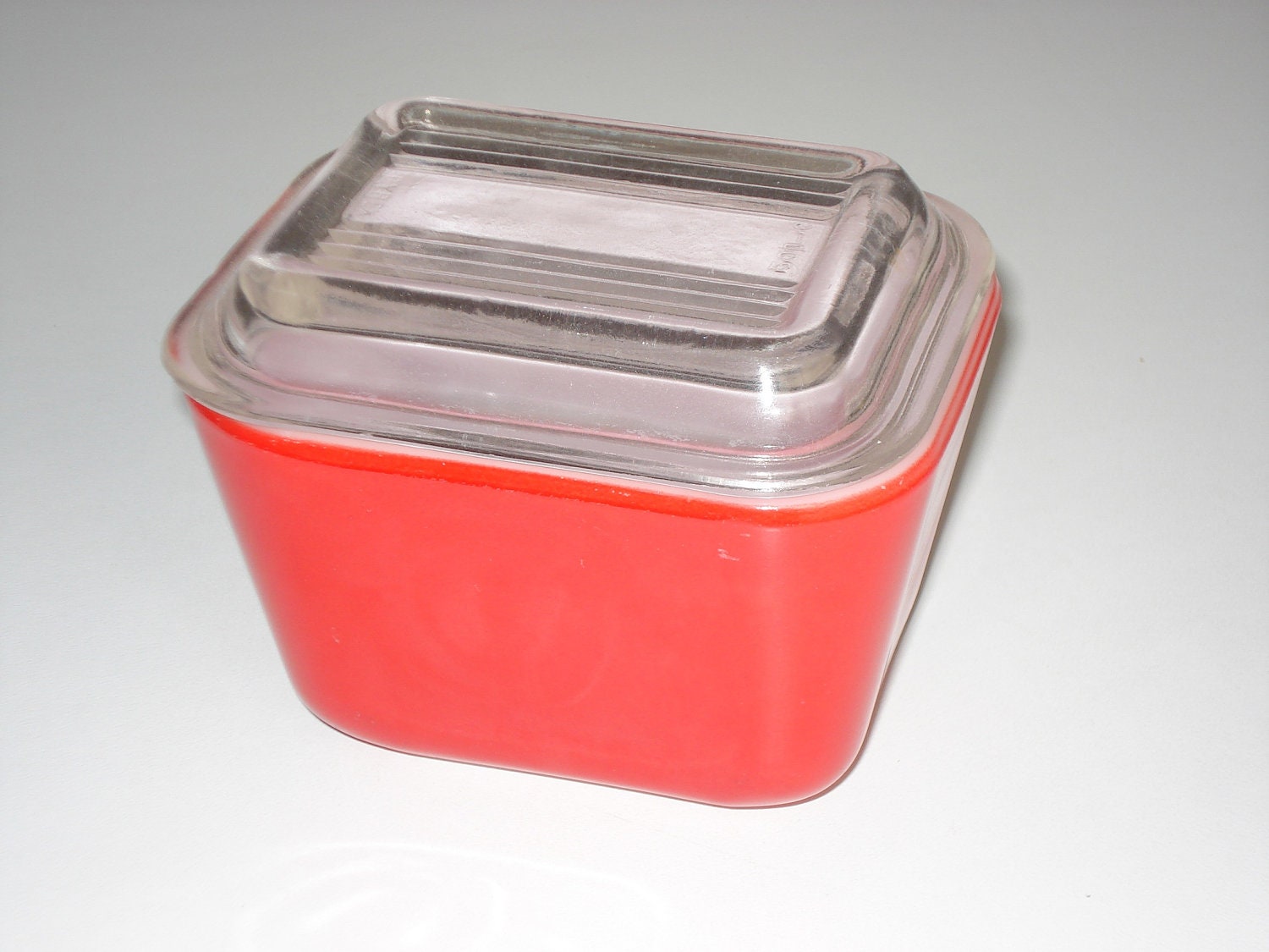 Vintage Pyrex red mini loaf pan with glass lid