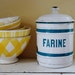 vintage enamelware canister, French lettering, white with blue stripes, made in Belgium