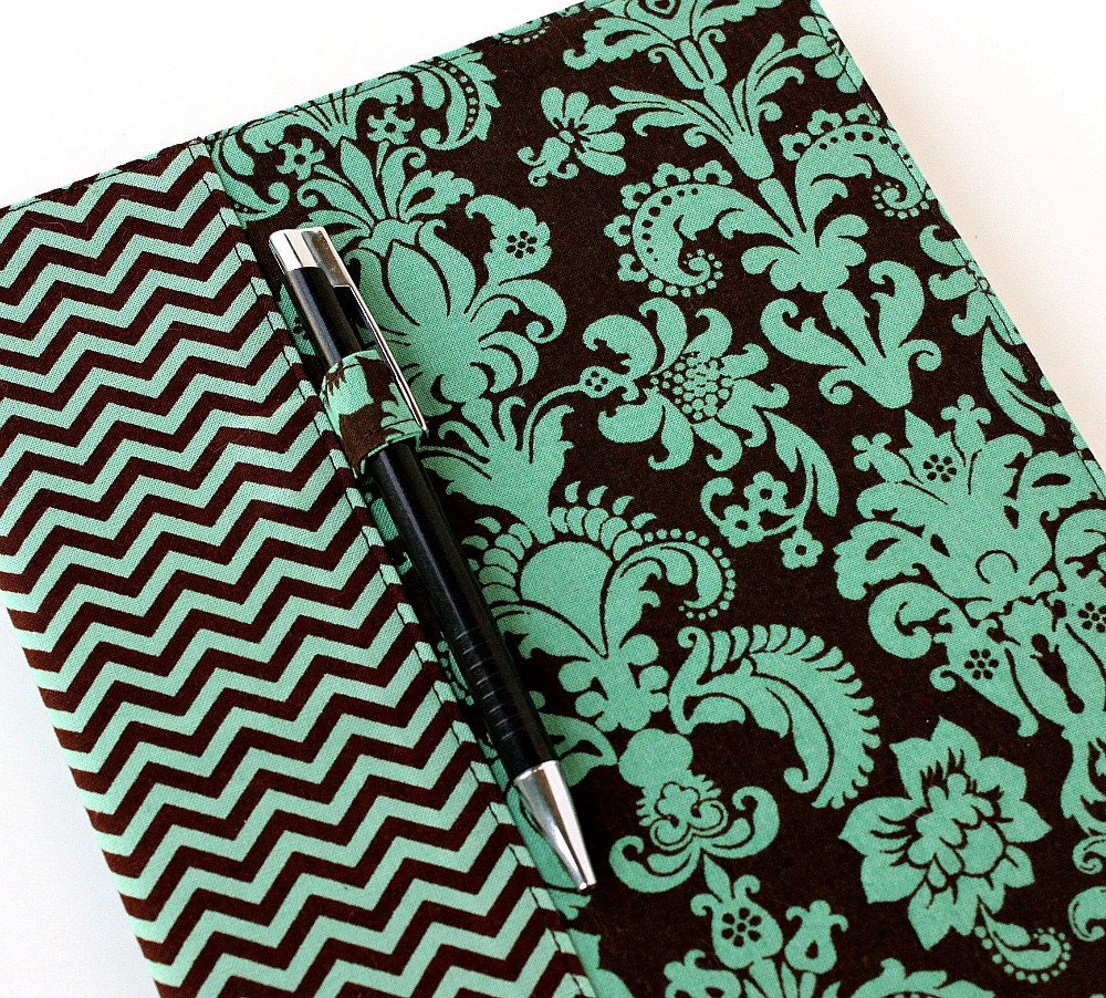 Composition notebook cover fabric cover includes pen