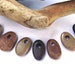 SMALL Beads beach pebbles. 7 smooth Spanish drilled beach rocks.