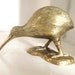 A large brass kiwi bird