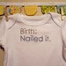 birth: nailed it --- white long-sleeved onesie, size 0-3 months --- blue