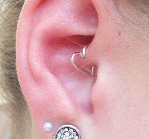 heart earring inside ear