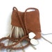 gold brown leather suede handbag messenger with cream off-white fringe and leaves. By Tuscada, ready to ship.