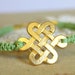 Friendship bracelet celtic knot green braided 14k gold plated .