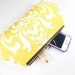 yellow and white clutch