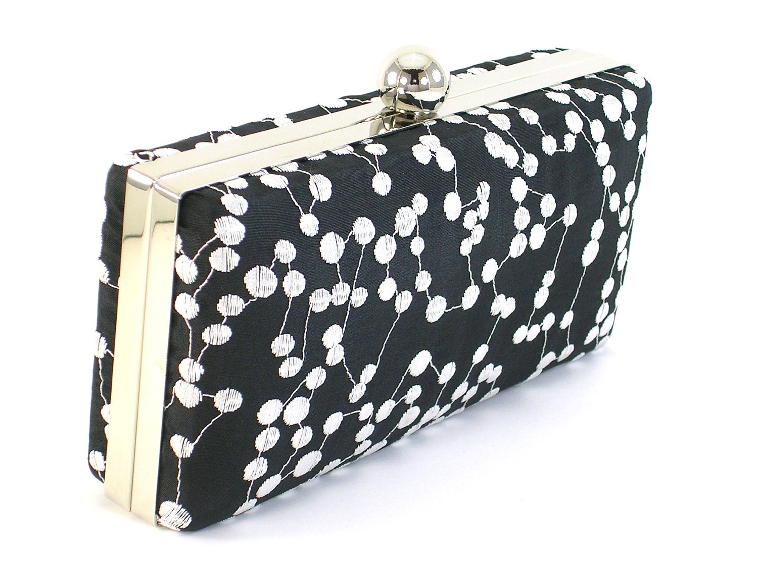 black and white spot clutch bag