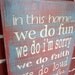 10" x 23" Wooden Sign - In this home...... we do.....