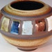 Round Lovely Pot With Colored Rectangles Around The Pot