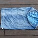 Distressed denim drawstring laundry bag