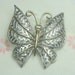 Vintage Silver and Gold TOne Metal Avon Butterfly Brooch with Blue Rhinestone Eyes