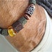 Men's Bracelet with Beads of Green Lava, Carved Wood, Bone, Ceramic, Amber Lampwork and Copper