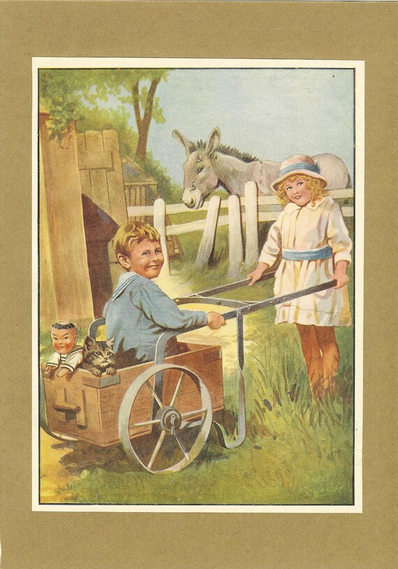 1922 Children's Print Blonde Girl White Dress Pushes Boy Wearing Sailor Suit In Wood Hand Cart Kitten Donkey Doll Vintage Book Illustration.
