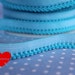 3 meters turquoise striped elastic trim with color-coordinated zigzag