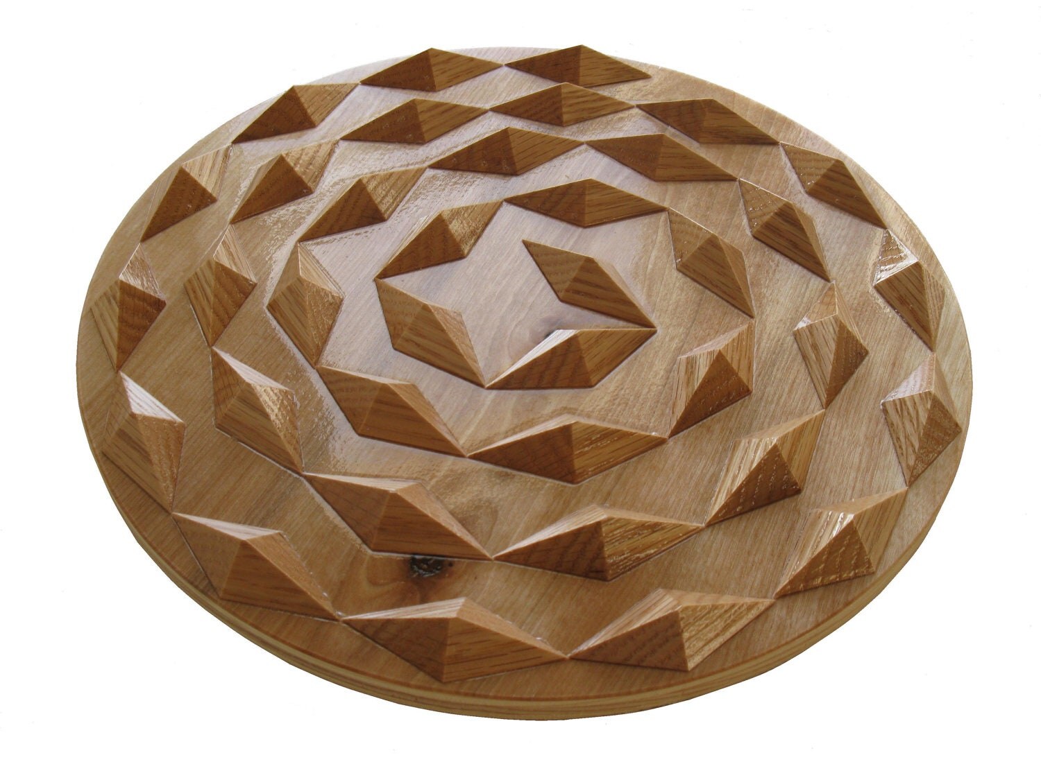 Spiral wood hot pad. Round wooden trivet with wood spirals.