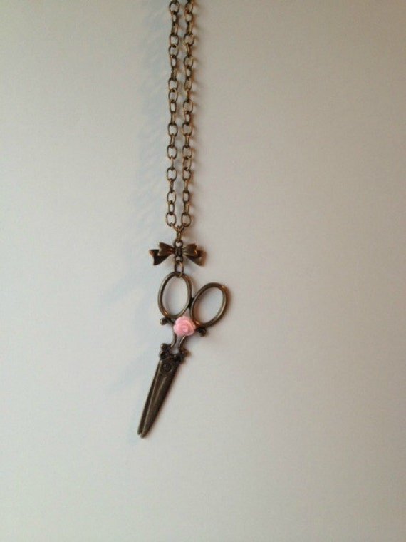 Scissor Happy Necklace Scissors Hanging from a Bow with a Pink