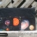 Pleated Space Print Swivel Hook Clutch