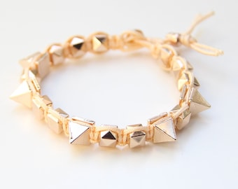 ON SALE! Arm candy - Gold Spikes beads and Peach cord - woven bracelet
