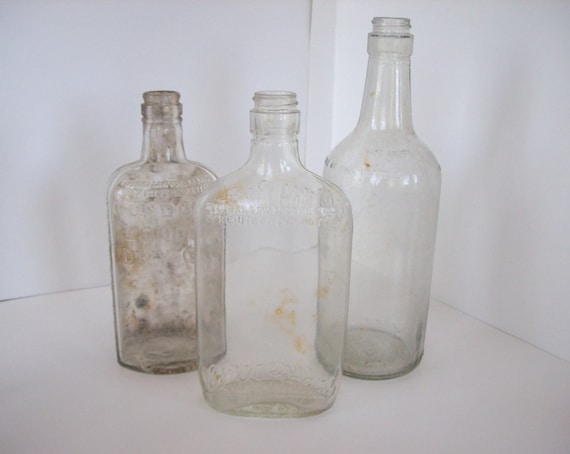 3 large clear glass whiskey bottles - prohibition era